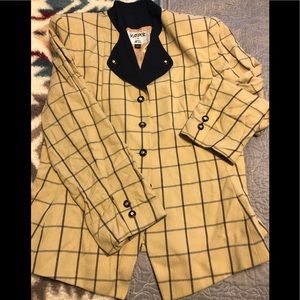 Woman’s skirt suit. Navy and gold jacket. Navy skirt.